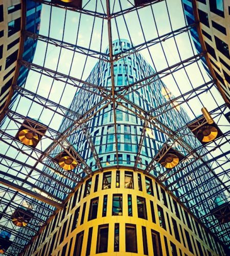 Glass and steel atrium in Warsaw showcasing modern architectural design.